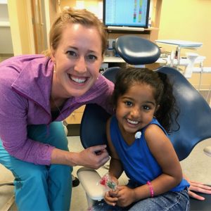 Dr. Lawson smiles with a patient who just finished her check-up.