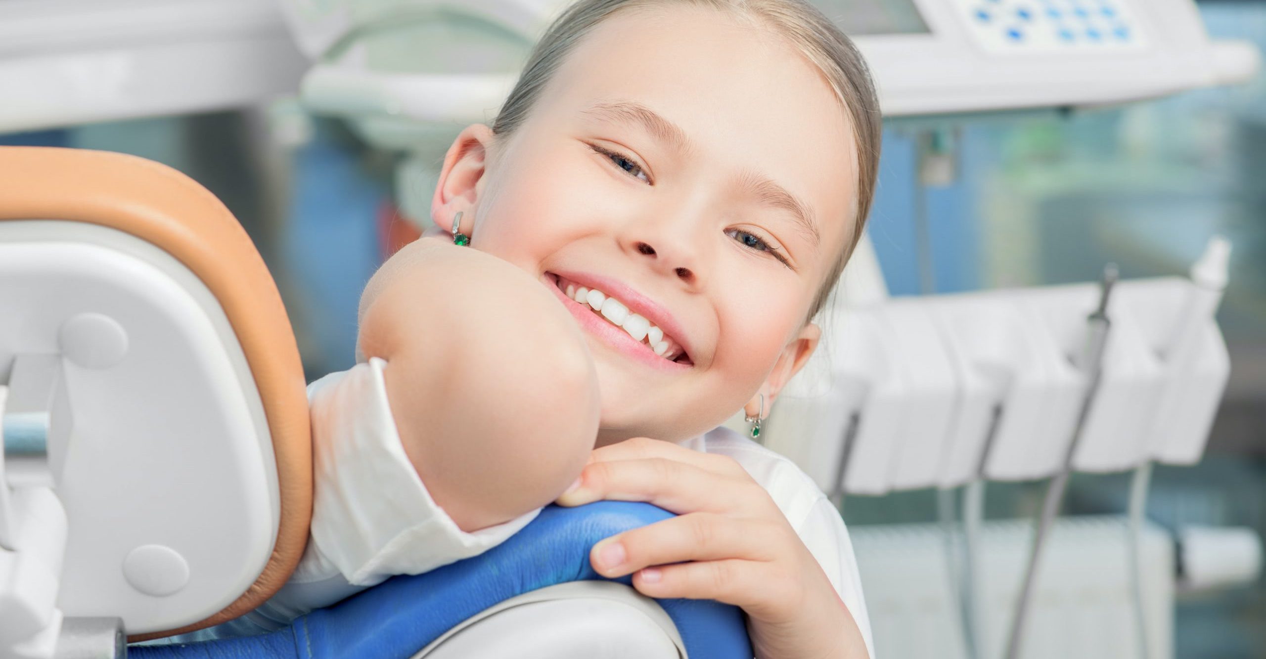 A photo of a young patient after her pediatric dentist visit